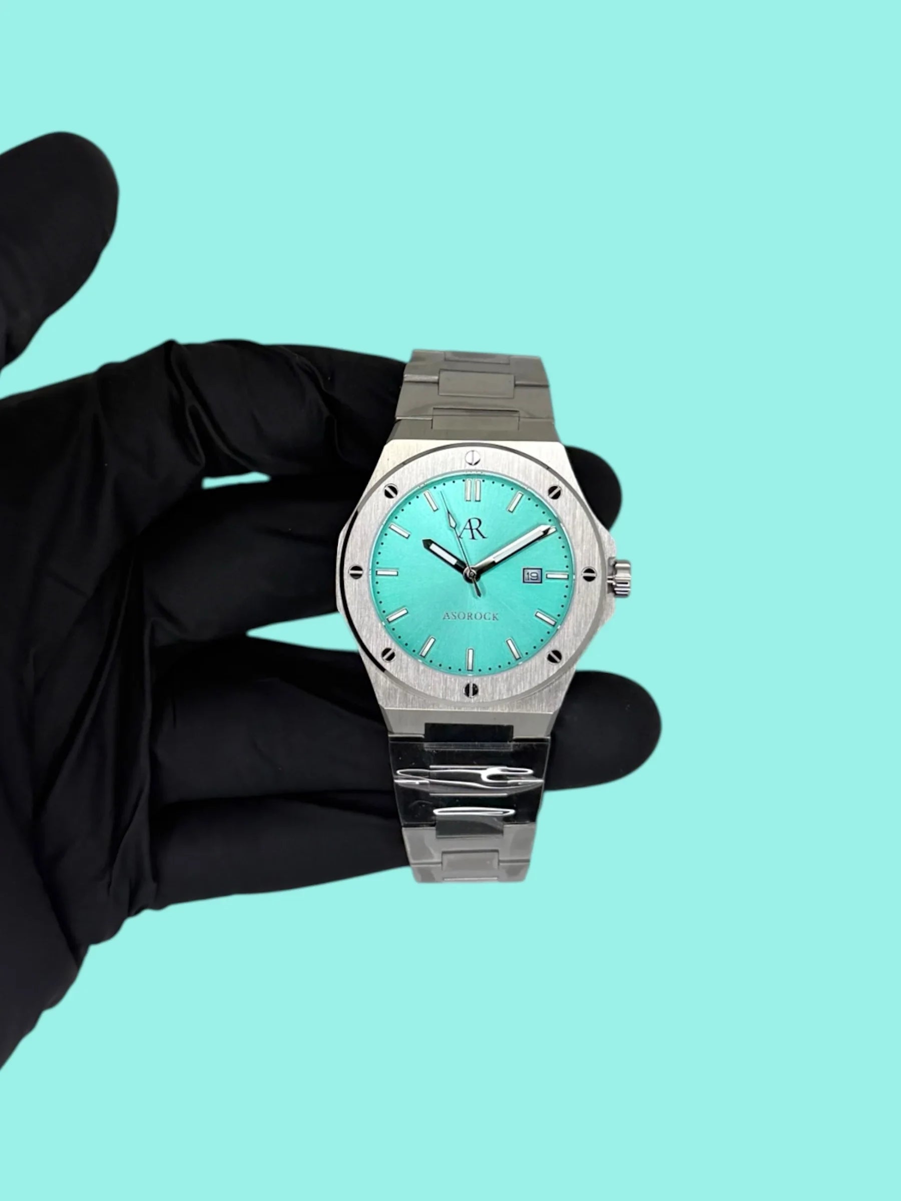 Silver/Blue turquoise dial Mansa - from ASOROCK WATCHES  a black african american owned luxury unique watch brand with swiss rolex, Audemars Piguet, patek homage inspired style watches. Also a custom vvs moissanite diamond watch maker.