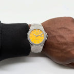Silver/yellow Mansa - from ASOROCK WATCHES  a black african american owned luxury unique watch brand with swiss rolex, Audemars Piguet, patek homage inspired style watches. Also a custom vvs moissanite diamond watch maker.